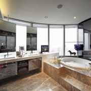 View of the bathroom.  The tiling is countertop, estate, interior design, kitchen, real estate, room, gray