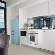 kitchen featuring smeg appliances, retro fridge, oven and home appliance, interior design, kitchen, real estate, gray