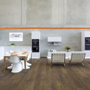 Showroom kitchen with wooden flooring and white kitchen ceiling, floor, flooring, interior design, laminate flooring, product design, table, wood, wood flooring, gray, white, brown