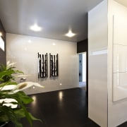 Bathroom with black floor tiles, white walls and architecture, ceiling, interior design, real estate, white