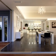 view from outside decking past dining room through apartment, ceiling, floor, flooring, home, house, interior design, living room, lobby, real estate, window, wood flooring, orange