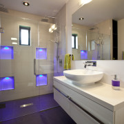 Bathroom with white vanity and raised basin, glass bathroom, home, interior design, product design, public toilet, purple, room, sink, gray