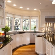 circular kitchen, white cabinets, dark benchtops, wooden floors. cabinetry, ceiling, countertop, cuisine classique, flooring, hardwood, interior design, kitchen, room, orange