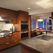 granite benchtop on island with sink, wooden cabinetry, cabinetry, countertop, cuisine classique, interior design, kitchen, real estate, room, brown