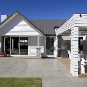 Exterior of house with white cladding and grey elevation, estate, facade, home, house, property, real estate, residential area, siding, window, gray