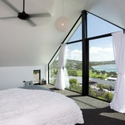 Seen here is a home designed by Chris architecture, bedroom, ceiling, daylighting, estate, home, house, interior design, property, real estate, room, window, gray, white