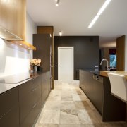 The owner of this kitchen designed by Sian apartment, architecture, cabinetry, ceiling, countertop, daylighting, floor, flooring, hardwood, home, house, interior design, kitchen, lobby, real estate, room, tile, wood flooring, gray, brown