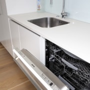 White benchtop with open dishwasher. - White benchtop countertop, home appliance, kitchen, product design, sink, tap, white