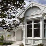 All the original character of this return-veranda bungalow architecture, building, cottage, estate, facade, historic house, home, house, mansion, outdoor structure, porch, property, real estate, residential area, siding, structure, tree, window, white