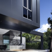 Black exterior, outside house looking at patio area architecture, building, condominium, daylighting, facade, home, house, residential area, window, black