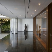 Foyer area with wooden wall. - Foyer area architecture, ceiling, daylighting, floor, flooring, house, interior design, lobby, real estate, gray, brown