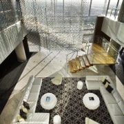 View down to lower story with white couch architecture, flooring, interior design, table, white, black