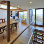 Stairs lead up to this open-plan kitchen and floor, house, interior design, real estate, window, wood, gray