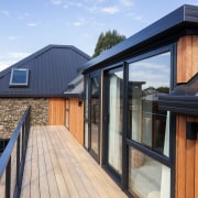 The clean lines of profiled metal roofing were 