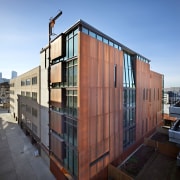 Exterior with red walls. - Exterior with red apartment, architecture, building, commercial building, condominium, corporate headquarters, facade, home, house, mixed use, neighbourhood, real estate, residential area, sky, window, black, teal