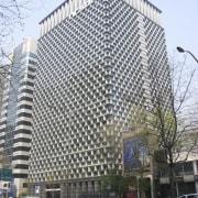 Exterior of office building. - Exterior of office architecture, building, city, commercial building, condominium, corporate headquarters, daytime, downtown, facade, headquarters, landmark, metropolis, metropolitan area, mixed use, residential area, skyscraper, tower block, white, gray