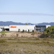 Blum building in the distance. - Blum building cottage, farm, field, grassland, home, house, land lot, landscape, mountain, prairie, property, real estate, rural area, sky, teal, brown