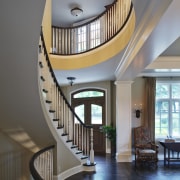 White walls and crown mouldings. Neutral furniture colours. architecture, ceiling, daylighting, estate, handrail, home, interior design, lobby, real estate, stairs, gray