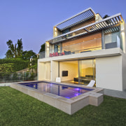 Exterior of house with pool and lawn. - backyard, elevation, estate, facade, home, house, property, real estate, residential area, swimming pool, villa, blue