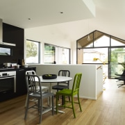 kitchen area, dining table, open-plan rooms flow into architecture, ceiling, dining room, floor, flooring, house, interior design, kitchen, living room, real estate, room, wood flooring, white