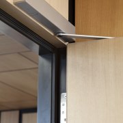 Close up of door opening system. - Close angle, line, product design, wood, gray