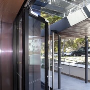 Door opening to paved path. - Door opening architecture, black, gray