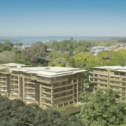 Exterior surrounded by trees. - Exterior surrounded by bird's eye view, condominium, land lot, mixed use, property, real estate, residential area, roof, suburb, brown