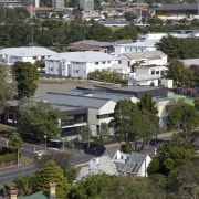 View of building from above. - View of aerial photography, bird's eye view, city, estate, home, house, mixed use, neighbourhood, property, real estate, residential area, roof, suburb, tree, urban area, urban design, brown