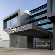 Exterior with dark grey cladding and TECT Arena architecture, building, commercial building, corporate headquarters, facade, real estate, gray, teal