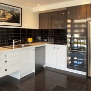 Kitchen with white cabinetry and stainless fridge, brown cabinetry, countertop, cuisine classique, flooring, interior design, kitchen, property, real estate, room, black, white