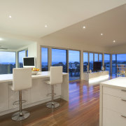 Kitchen with wooden flooring, white stools and white apartment, ceiling, interior design, living room, penthouse apartment, real estate, room, window, gray, brown
