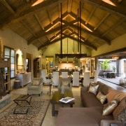 Rustic house modelled on French barn. Interiors feature home, interior design, living room, lobby, room, brown