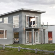 exterior of house grey and white cladding - building, cottage, elevation, facade, home, house, property, real estate, residential area, siding, white, gray