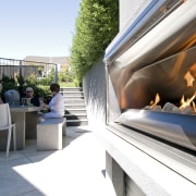 The Moorings in Taupo by Haimes Building, fireplace architecture, white