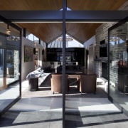 pointed timber roof, dark coloured fabrics in living interior design, black, gray