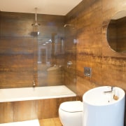 bathroom setting with circular basin, toilet and bath/shower bathroom, floor, interior design, property, room, wood, brown, orange