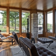 luxury leather furniture in open room, high windows, home, house, interior design, living room, outdoor structure, patio, porch, real estate, window, wood, brown