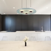This bank of kitchen cabinets extends outdoors to architecture, ceiling, interior design, product design, room, white