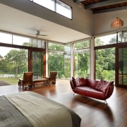 This master bedroom has a peaceful air, matching architecture, ceiling, daylighting, door, estate, floor, flooring, hardwood, home, house, interior design, living room, real estate, window, wood, wood flooring, gray