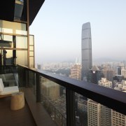 Exterior view of the decking and Shanghai skyline. apartment, architecture, balcony, building, city, condominium, metropolis, metropolitan area, property, real estate, sky, skyscraper, black, white