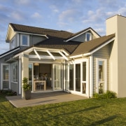 Afternoon view of exterior - Afternoon view of building, cottage, elevation, estate, facade, farmhouse, home, house, orangery, property, real estate, residential area, roof, villa, brown, teal