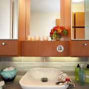 Facing page: This teenagers bathroom, by Roberta Kravette, bathroom, ceiling, floor, home, interior design, product design, room, sink, white, orange