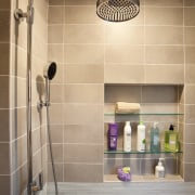 Facing page: This teenagers bathroom, by Roberta Kravette, bathroom, floor, flooring, interior design, plumbing fixture, room, shower, sink, tap, tile, orange, brown