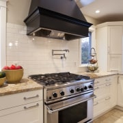 This kitchen was designed by Nadia Subaran of cabinetry, countertop, cuisine classique, gas stove, home appliance, interior design, kitchen, kitchen appliance, kitchen stove, major appliance, oven, room, gray