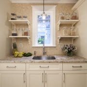 This kitchen was designed by Nadia Subaran of bathroom, cabinetry, countertop, cuisine classique, home, interior design, kitchen, room, sink, wall, orange