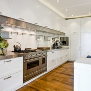 Contemporary stainless steel accents in this new kitchen cabinetry, countertop, cuisine classique, interior design, kitchen, real estate, room, white