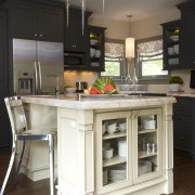 This kitchen was designed by Susan Brunstrum, Sweet cabinetry, countertop, cuisine classique, dining room, flooring, furniture, hardwood, home appliance, interior design, kitchen, kitchen stove, room, table, wood flooring, black, white