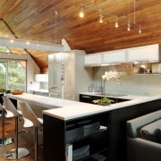 Slide-fold doors were added at one end of architecture, ceiling, countertop, house, interior design, kitchen, living room, real estate, table, brown