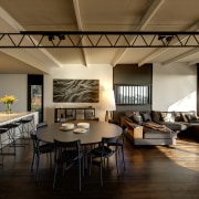 Interior shot of living area with kitchen and ceiling, daylighting, dining room, interior design, living room, real estate, room, table, brown, black