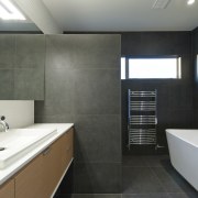 Contemporary gray and white bathroom with freestanding tub, architecture, bathroom, bathroom accessory, home, house, interior design, property, real estate, room, sink, gray, black